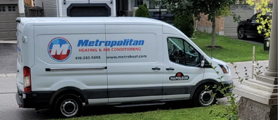 The Metropolitan Heating and Air Conditioning owner beside a branded service truck in Scarborough, ON